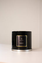 Black candle with 'Li Home Sable' label on a beige background
