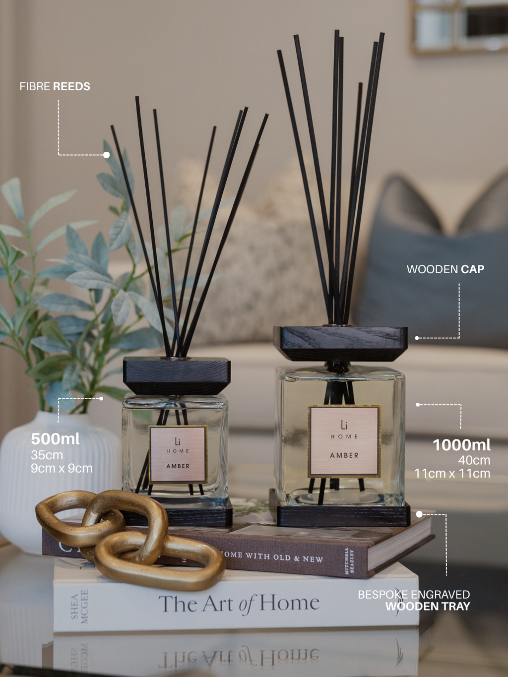 Two diffusers with wooden caps on a surface with text labels.