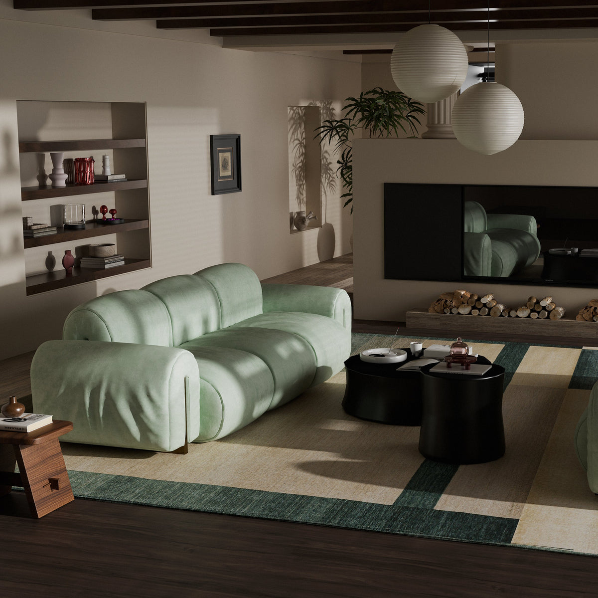 A modern living room featuring a light sage green modular sofa with a wavy, segmented design, styled on a patterned rug with black coffee tables and a large wall-mounted TV.