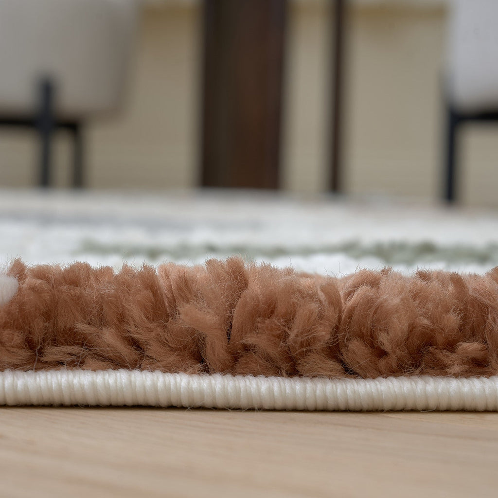 Close-up of a brown textured rug on a wooden floor with a blurred background