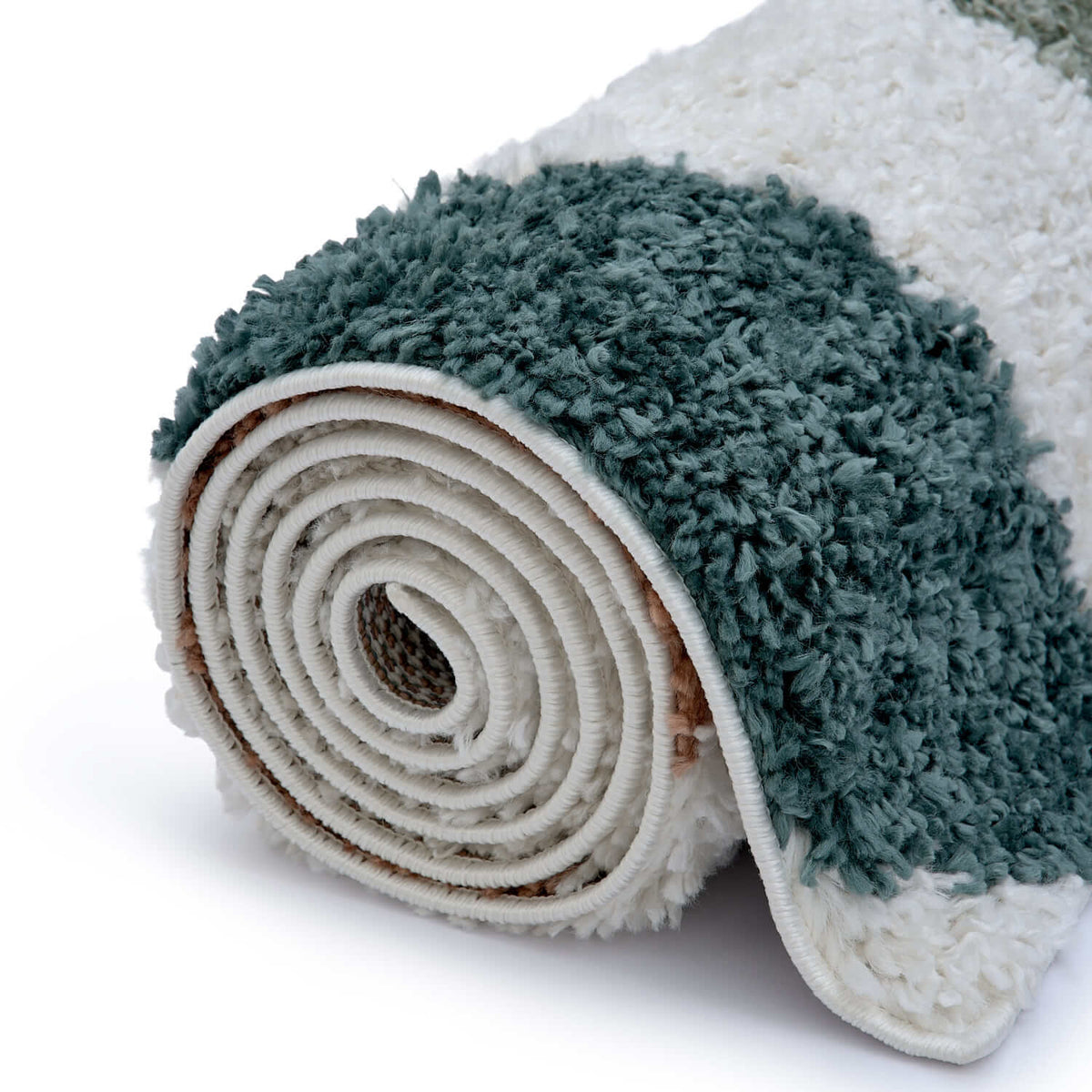Roll of green and white textured rug on a white background