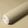 Roll of beige textured wallpaper on a matching background