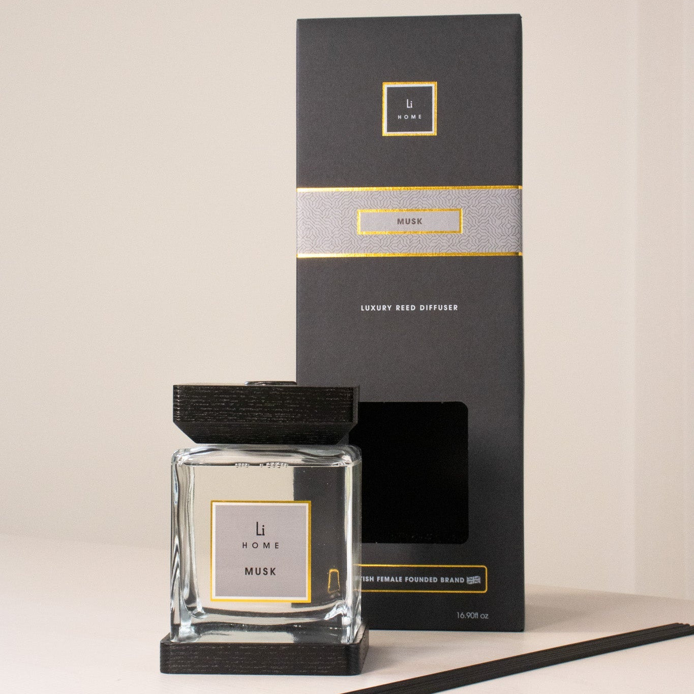 Aromatherapy diffuser with packaging on a neutral background