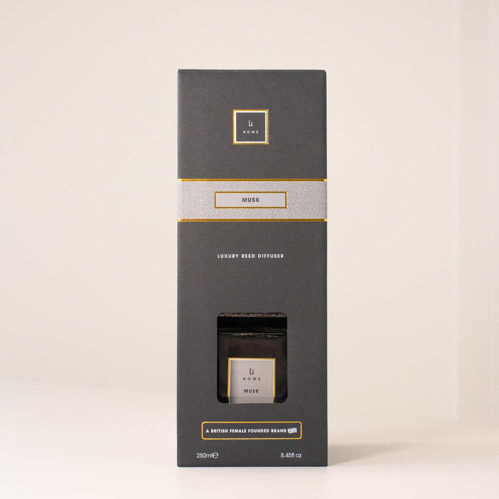 Black box packaging with gold accents on a white background