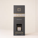 Black box packaging with gold accents on a white background