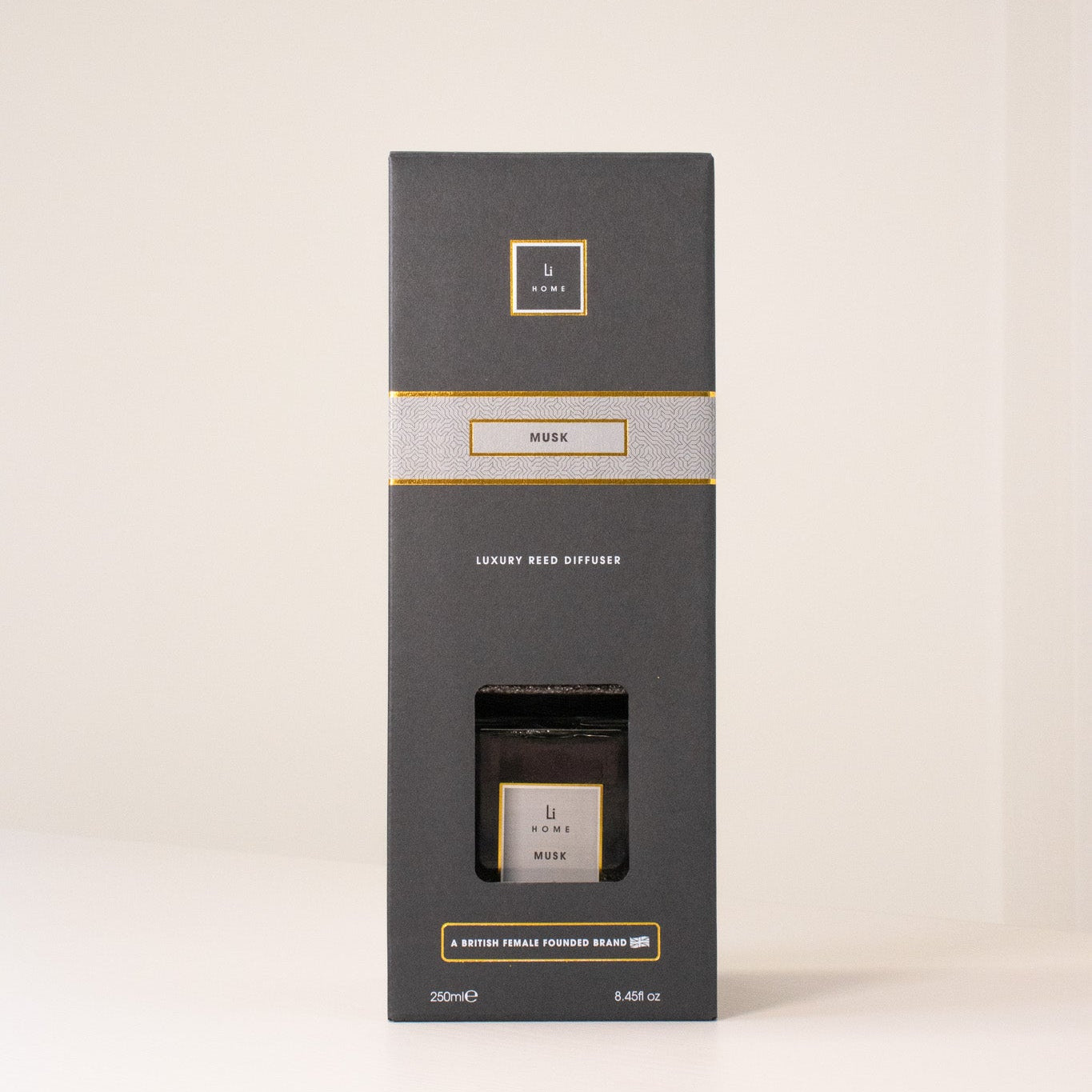 Black box packaging with gold accents on a white background