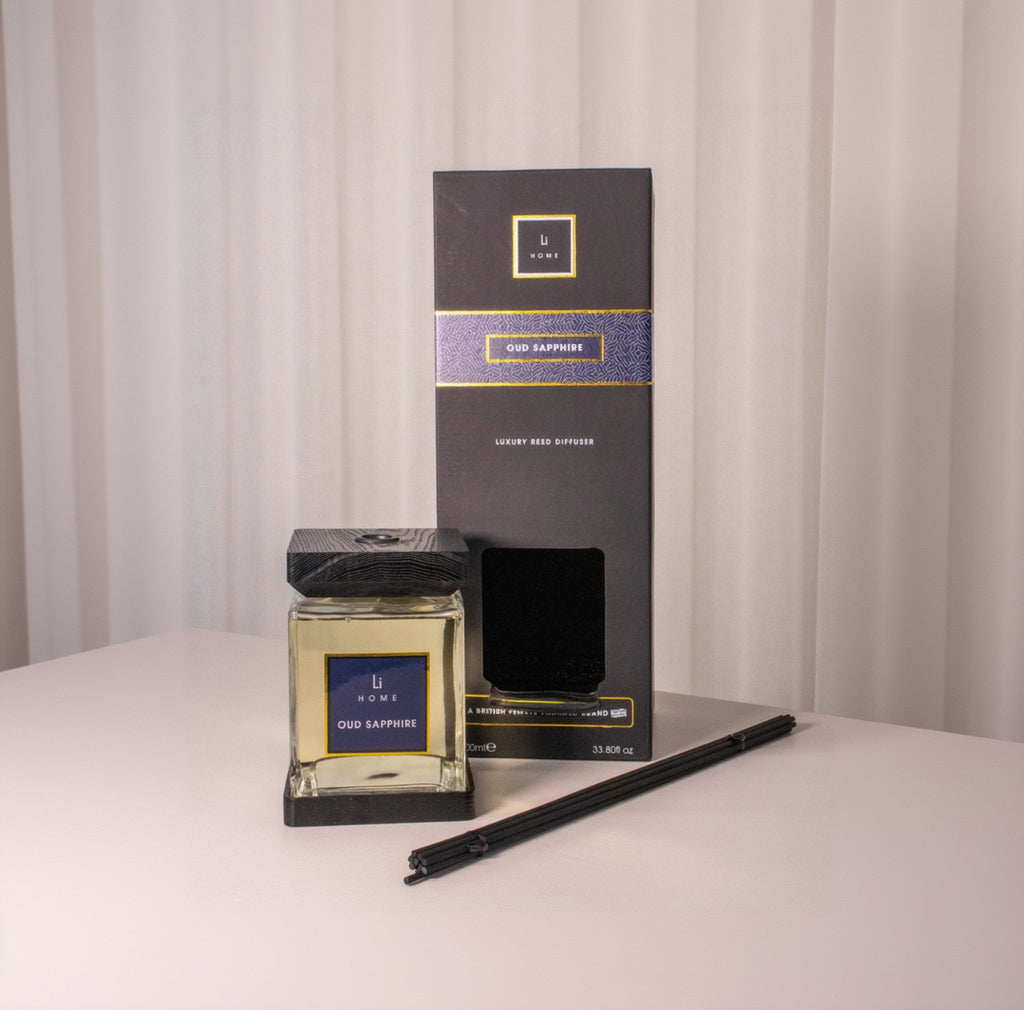 Oud Sapphire diffuser and packaging on a neutral background