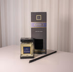 Oud Sapphire diffuser and packaging on a neutral background