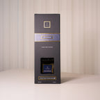 Dark gray packaging box with gold accents on a light background