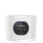 White candle with a black label featuring the 'Parks London' brand on a white background