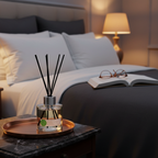 Diffuser on a nightstand with a book and glasses in a bedroom setting