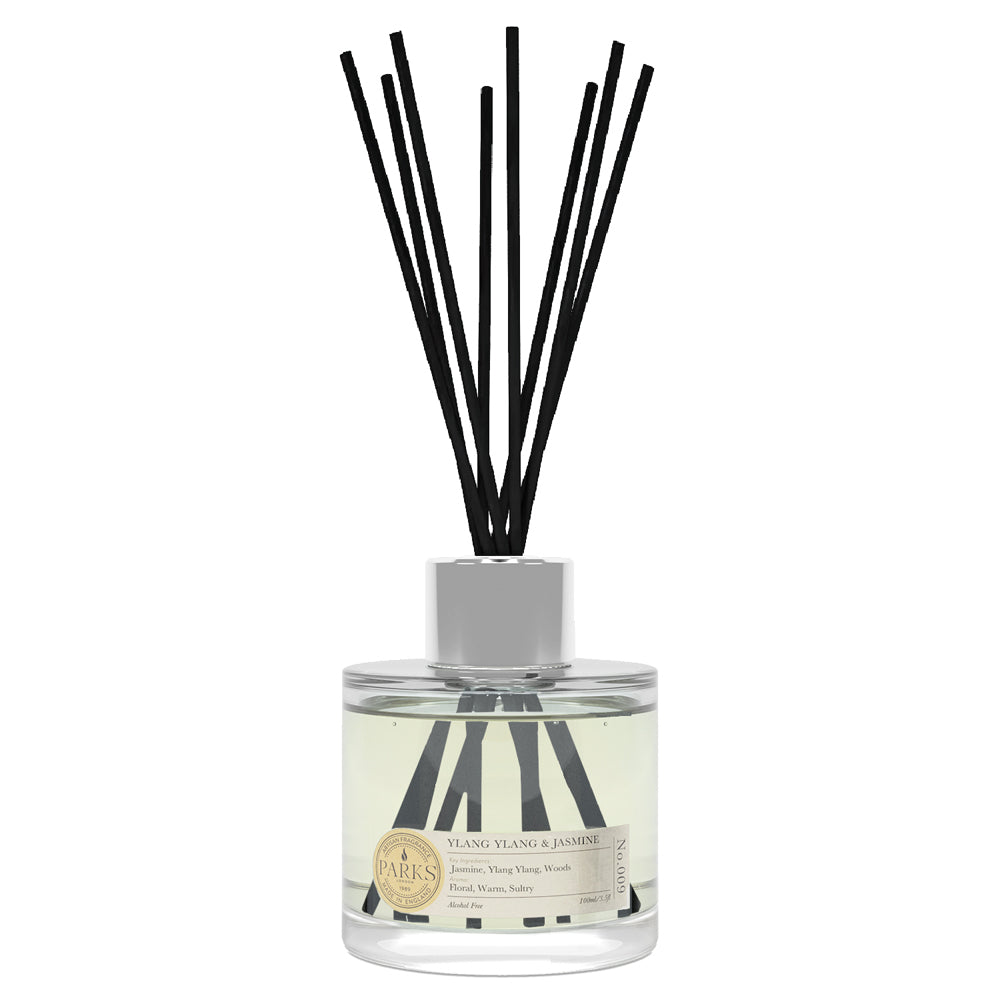 Diffuser bottle with black reeds on a white background
