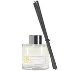Diffuser bottle with black reeds on a white background