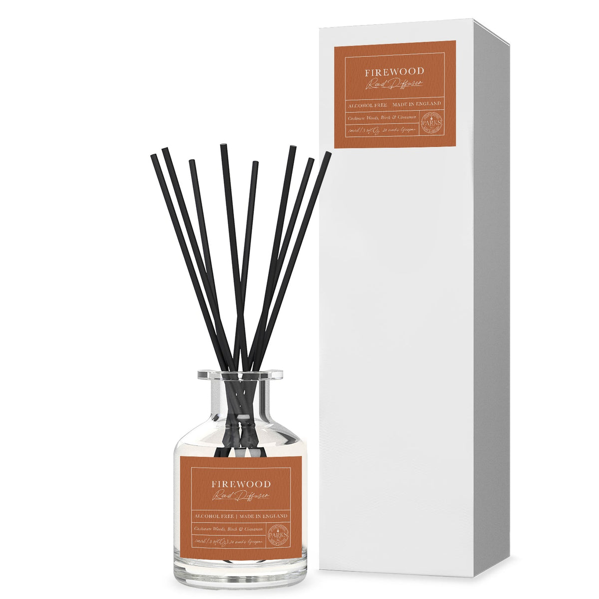 Firewood diffuser bottle with black sticks and packaging on a white background