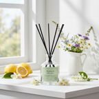 Diffuser with 'Tranquil' label on a windowsill with lemons and flowers