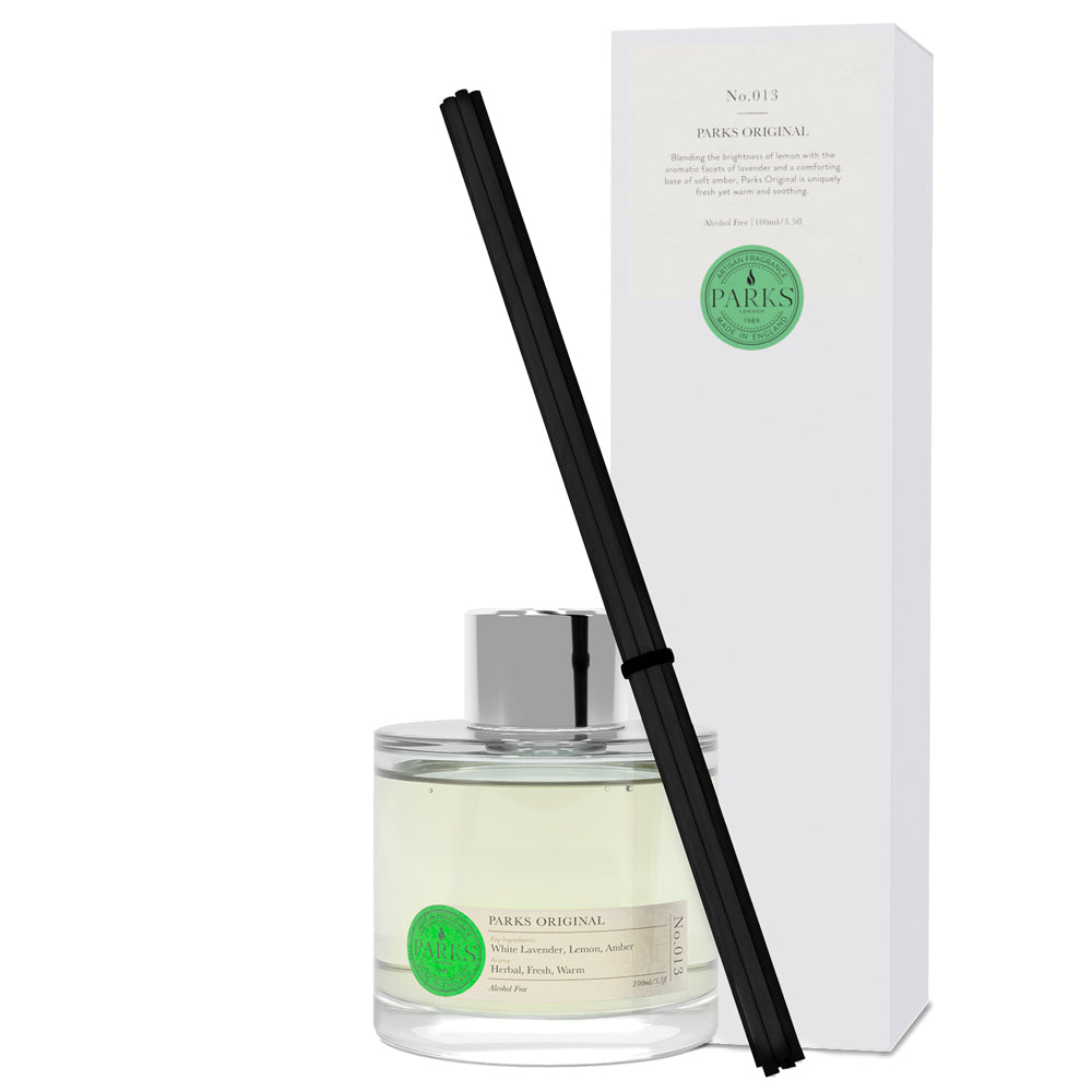 Parks Original diffuser bottle with black diffuser stick and white box on a white background