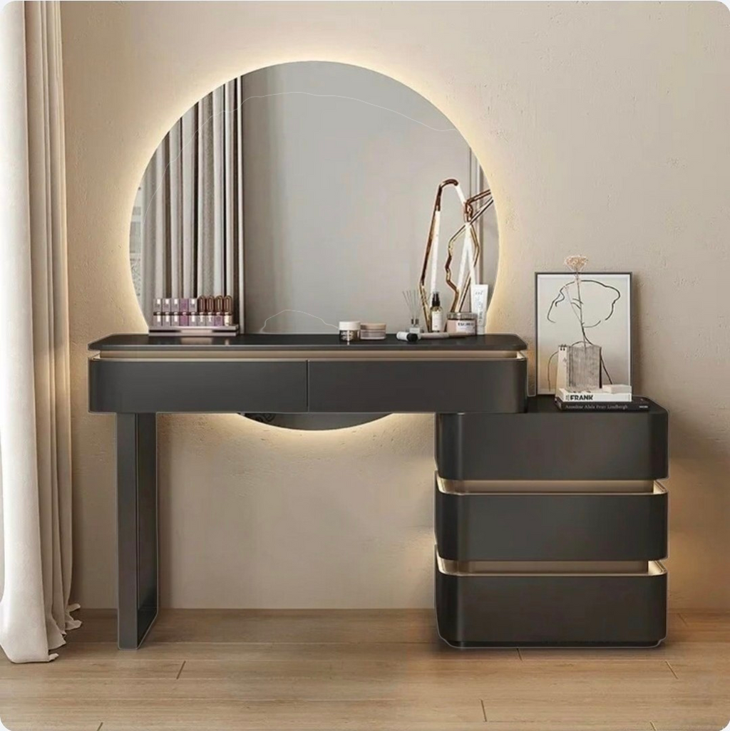 Modern vanity table with round mirror and lighting in a room setting.