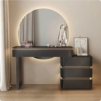 Modern vanity table with round mirror and lighting in a room setting.