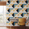 Modern interior with geometric patterned wall, desk, and chair.