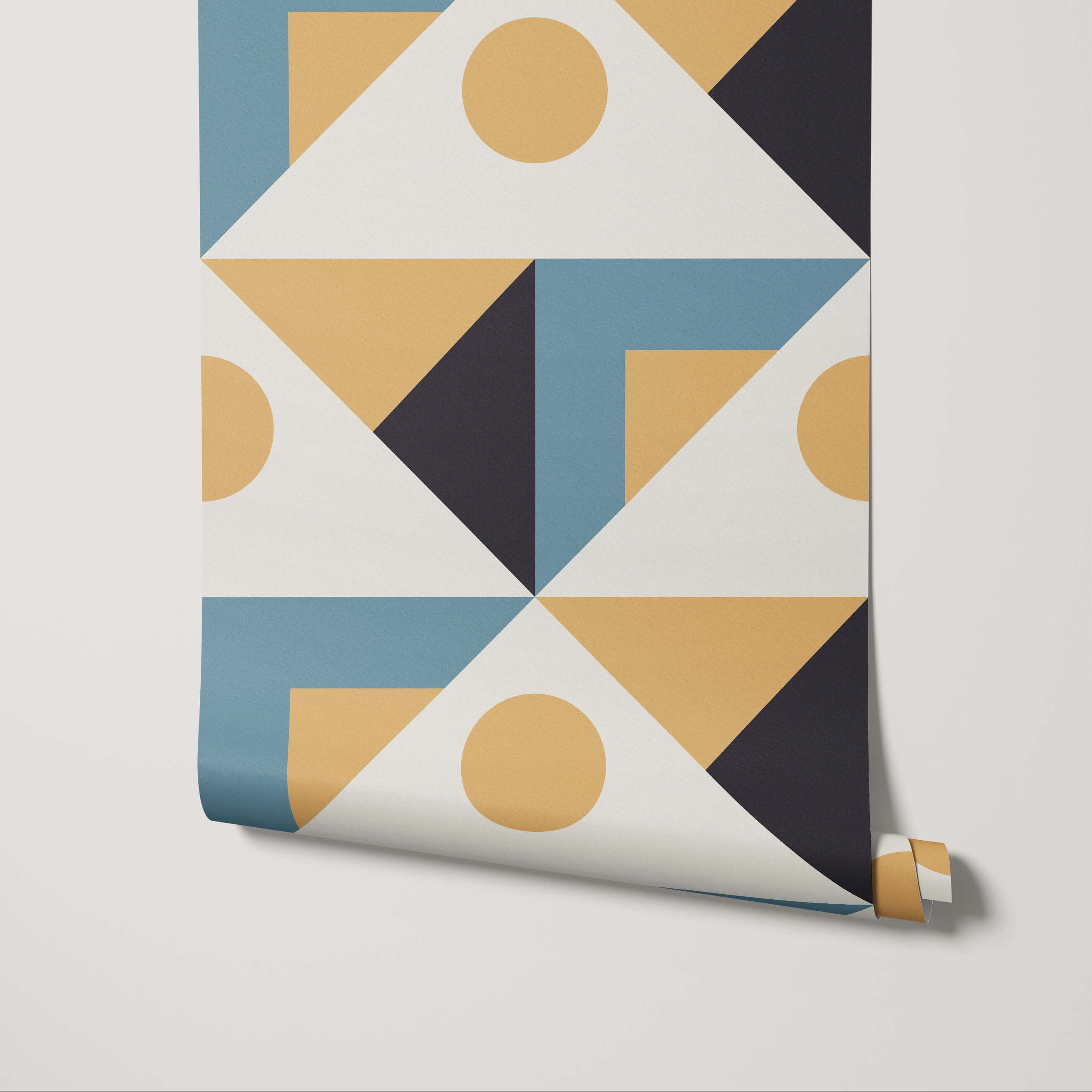 Roll of geometric-patterned wallpaper with blue, gold, and black design on a light gray background