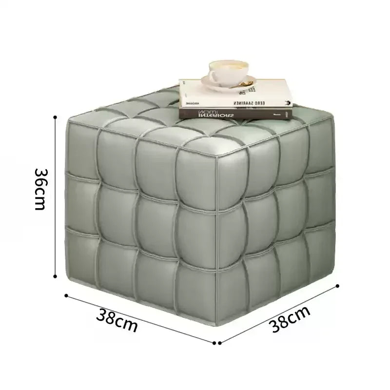 Cube-shaped ottoman with dimensions labeled on a white background