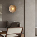 Desert Scandi wall lamp with a minimalist metal design and warm white LED lighting for modern bedrooms and living spaces.