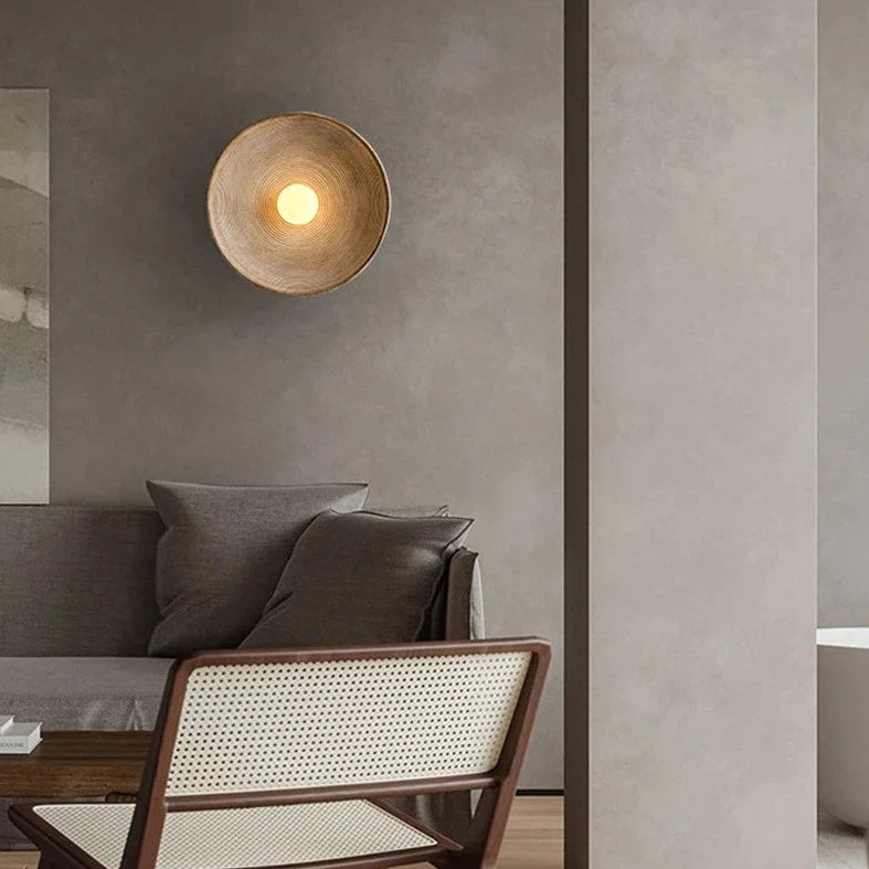 Desert Scandi wall lamp with a minimalist metal design and warm white LED lighting for modern bedrooms and living spaces.