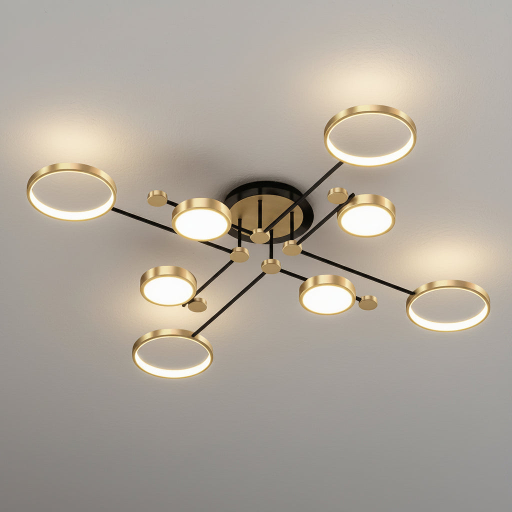 Modern multi-light ceiling fixture with circular LED bulbs on black and gold branches, shown installed on a light gray ceiling.