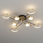 Modern multi-light ceiling fixture with circular LED bulbs on black and gold branches, shown installed on a light gray ceiling.