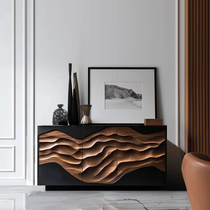 Modern interior with a wooden sideboard, vases, and a framed picture on a white wall.