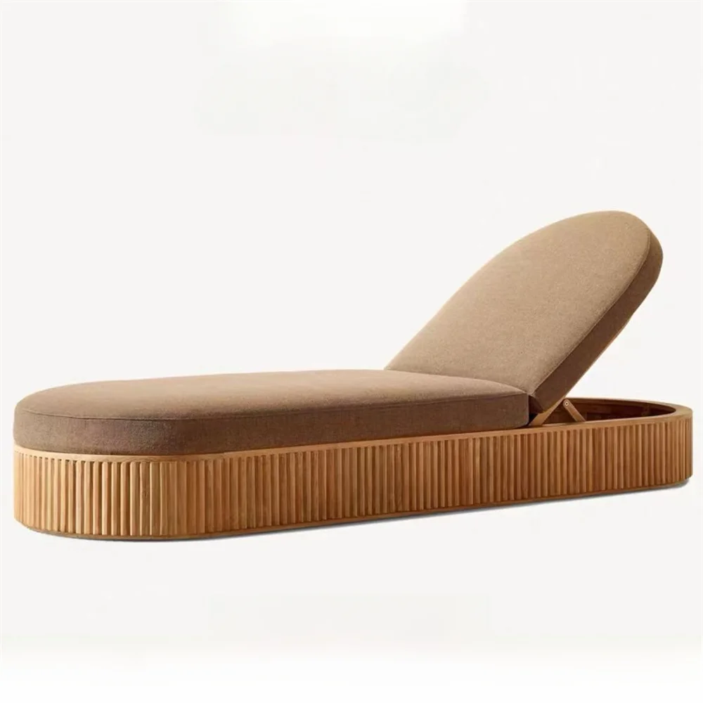 Brown lounge chair with wicker base on a white background