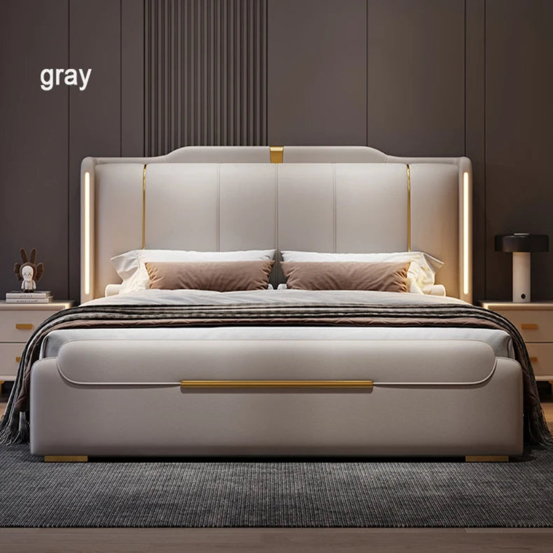 Gray upholstered bed with gold accents in a bedroom setting