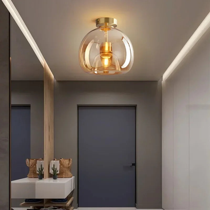 Modern dome semi-flush glass ceiling light with black or gold finish and E27 bulb fitting for stylish interior lighting.