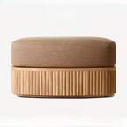 Brown ottoman with textured base on a white background