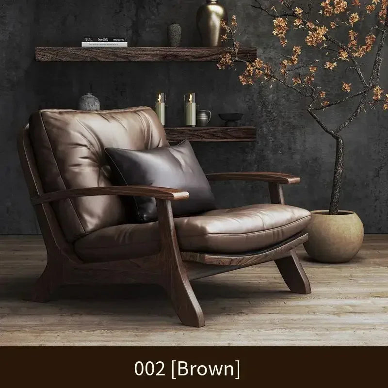 Brown leather armchair in a room with dark walls and decorative elements.