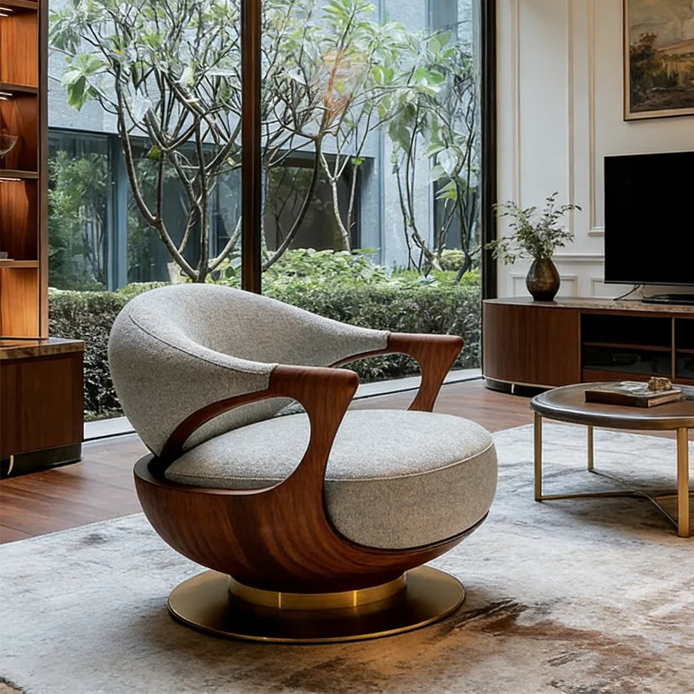 Modern living room with a stylish armchair and a view of greenery outside.