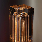 Decorative lamp with a metallic finish on a dark background