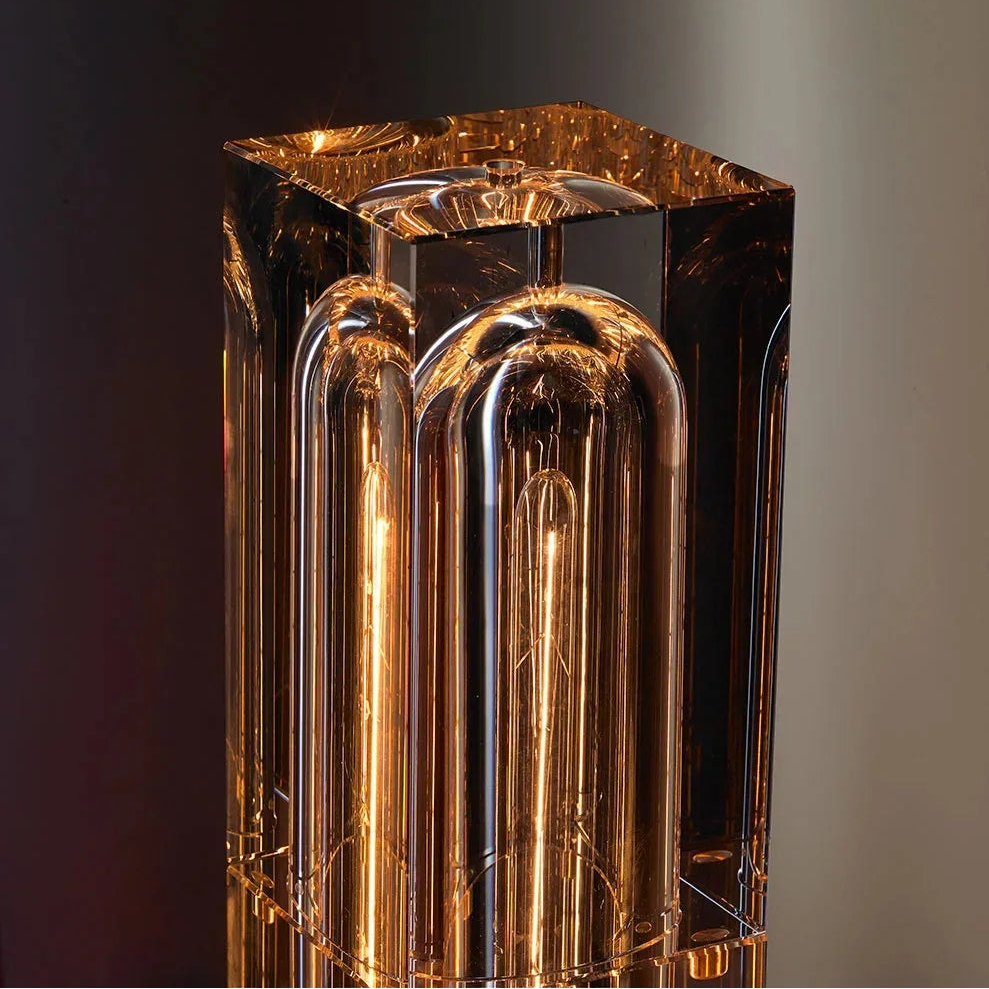 Decorative lamp with a metallic finish on a dark background