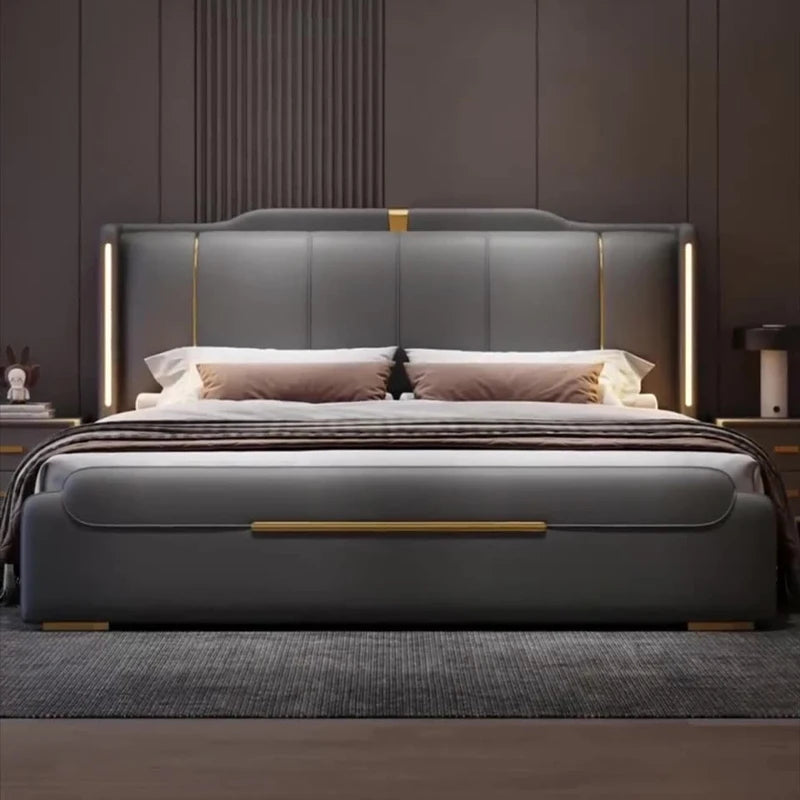 Gray upholstered bed with gold accents in a bedroom setting