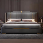 Gray upholstered bed with gold accents in a bedroom setting