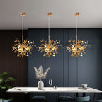 Three modern chandeliers hanging above a dining table with a dark wall background.