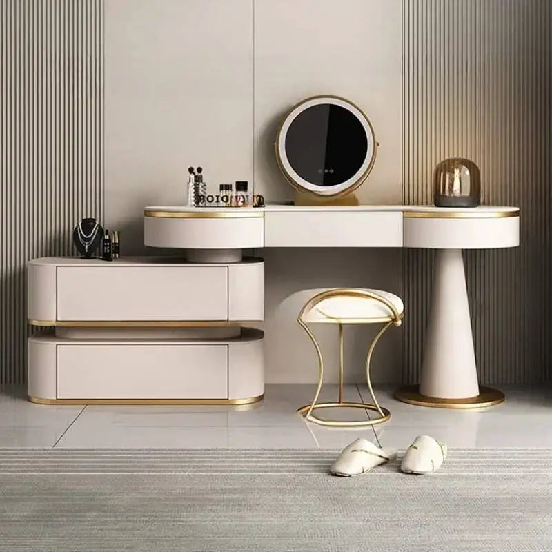 Modern vanity table with mirror, stool, and decorative items in a stylish room.