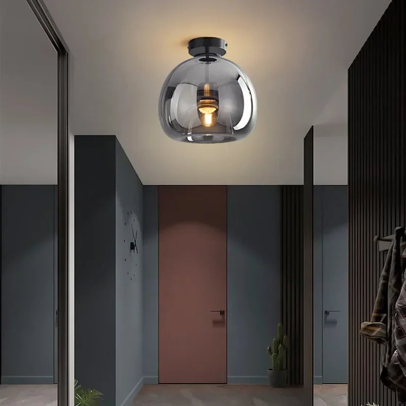 Modern dome semi-flush glass ceiling light with black or gold finish and E27 bulb fitting for stylish interior lighting.