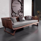 Modern wooden sofa with gray cushions in a stylish room.