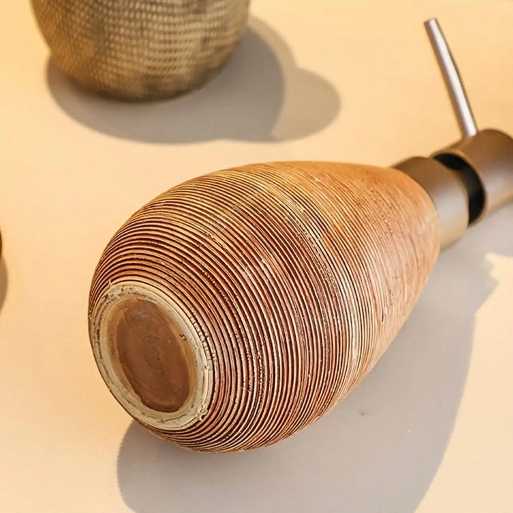 Close-up of a wooden fishing rod handle on a light background