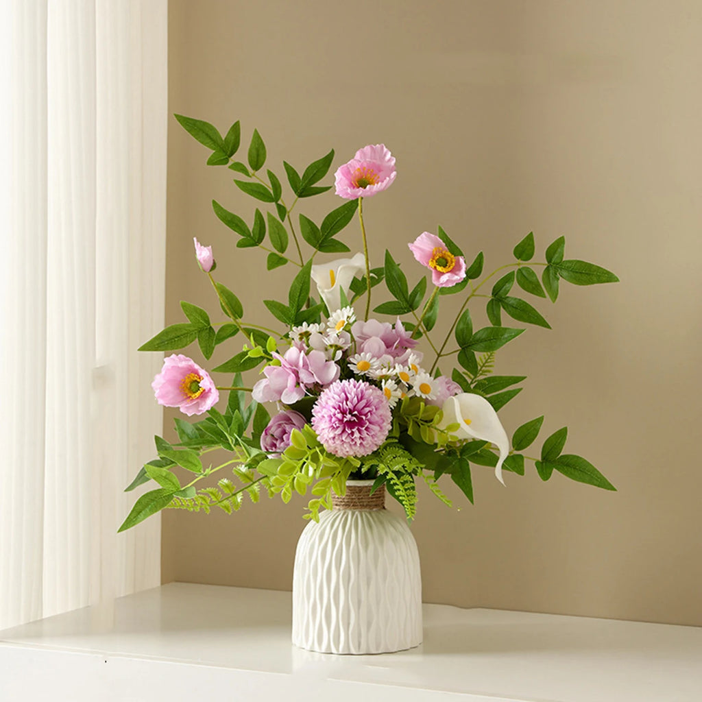 Bouquet of flowers in a white vase on a shelf with a beige wall background