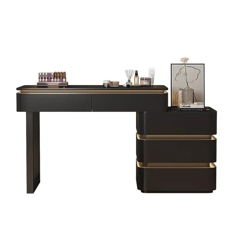 Black and gold vanity table with cosmetic items on a white background
