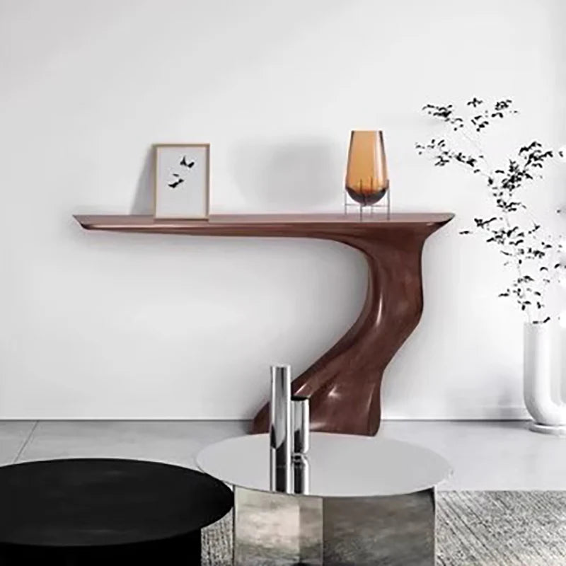 Modern console table with decorative items against a white wall