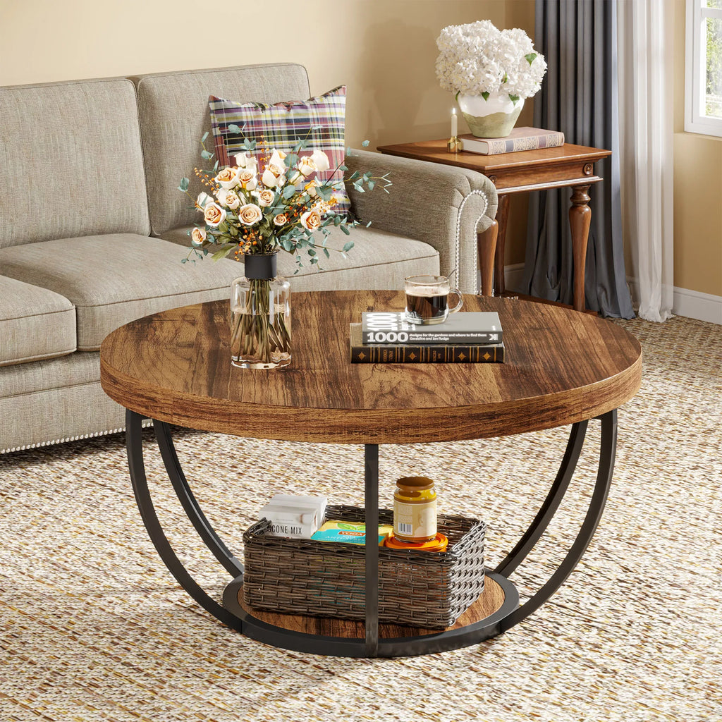 Round wooden coffee table with decorative items in a living room setting.