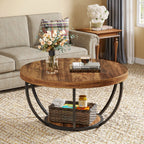 Round wooden coffee table with decorative items in a living room setting.